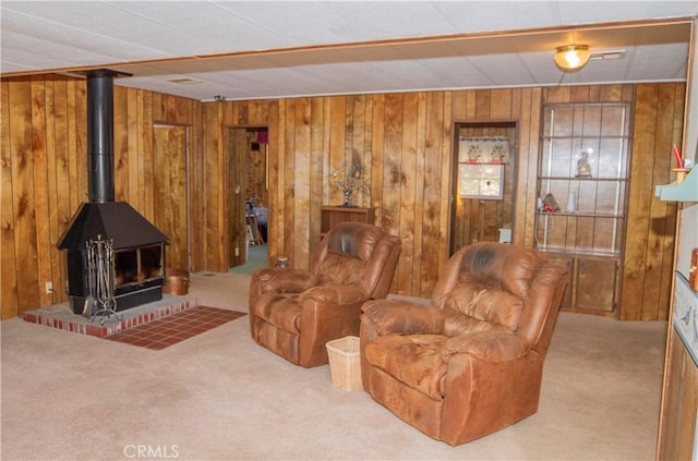 46424 Baldpate Ln, Squaw Valley, CA 93675 - carpeted living room with wood walls and a wood stove