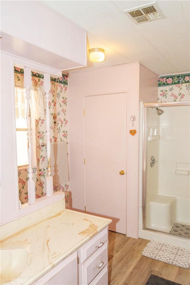 46424 Baldpate Ln, Squaw Valley, CA 93675 - bathroom featuring vanity, wood finished floors, and a stall shower