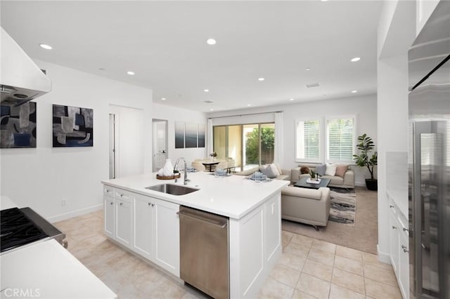 138 Jayhawk, Irvine, CA 92602 - kitchen with stainless steel appliances, white cabinets, open floor plan, light tile patterned flooring, and recessed lighting