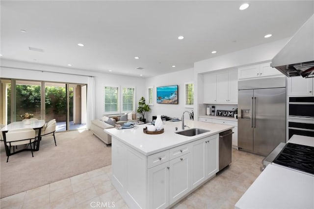138 Jayhawk, Irvine, CA 92602 - kitchen featuring stainless steel appliances, light colored carpet, light countertops, ventilation hood, and recessed lighting