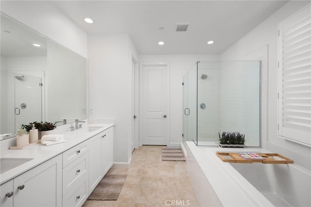138 Jayhawk, Irvine, CA 92602 - bathroom featuring recessed lighting, double vanity, a stall shower, a garden tub, and tile patterned floors