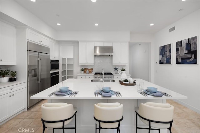 138 Jayhawk, Irvine, CA 92602 - kitchen featuring stainless steel built in fridge, under cabinet range hood, white cabinetry, light countertops, and recessed lighting