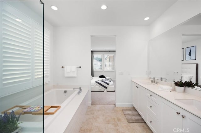 138 Jayhawk, Irvine, CA 92602 - ensuite bathroom with double vanity, a garden tub, recessed lighting, and tile patterned floors