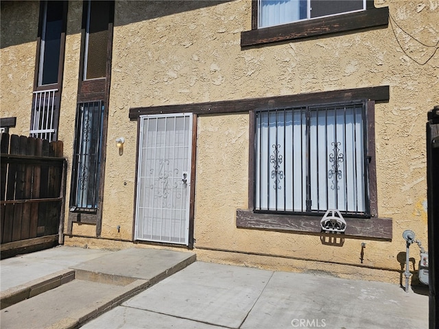 7941 Midhurst Dr, Highland, CA 92346 - view of exterior entry with stucco siding