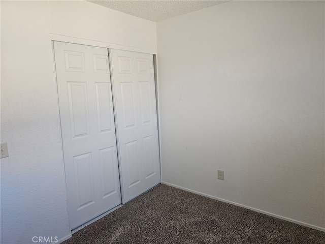 7941 Midhurst Dr, Highland, CA 92346 - unfurnished bedroom featuring carpet, a closet, and a textured ceiling