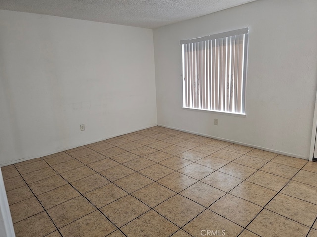 7941 Midhurst Dr, Highland, CA 92346 - unfurnished room featuring a textured ceiling and light tile patterned floors