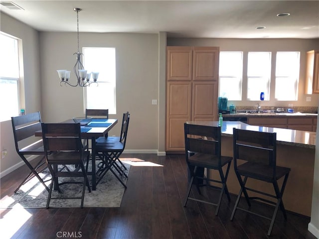 707 Joseph Pl, Isleton, CA 95641 - dining room featuring healthy amount of natural light, a chandelier, dark wood-type flooring, and recessed lighting