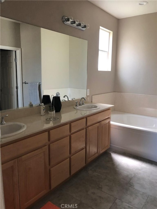 707 Joseph Pl, Isleton, CA 95641 - bathroom featuring double vanity, a garden tub, and tile patterned flooring