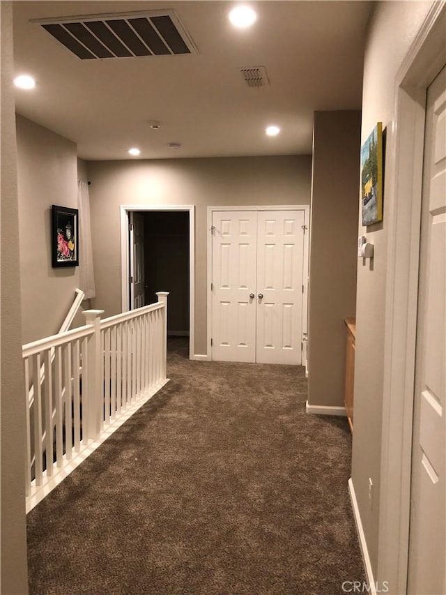 707 Joseph Pl, Isleton, CA 95641 - corridor featuring an upstairs landing, dark colored carpet, and recessed lighting