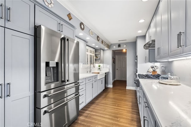 10041 Margo Ln, Westminster, CA 92683 - kitchen with stainless steel fridge, range with gas stovetop, range hood, recessed lighting, and wood finished floors