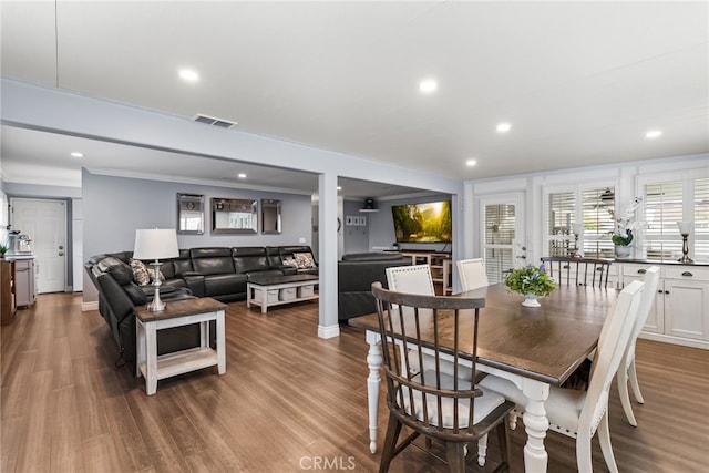 10041 Margo Ln, Westminster, CA 92683 - dining space with recessed lighting, wood finished floors, and crown molding