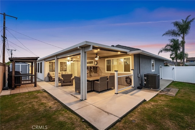 10041 Margo Ln, Westminster, CA 92683 - back of house with a ceiling fan, a patio, a gate, an outdoor hangout area, and stucco siding