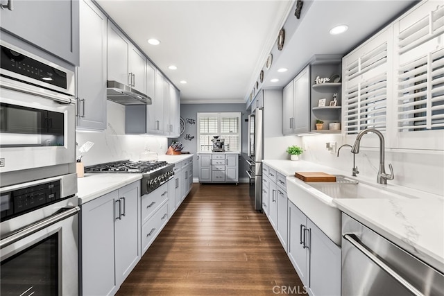 10041 Margo Ln, Westminster, CA 92683 - kitchen with appliances with stainless steel finishes, recessed lighting, open shelves, ornamental molding, and dark wood-style floors