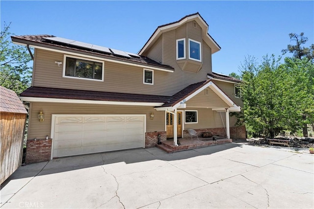 1104 Snowbird Dr, Frazier Park, CA 93225 - traditional home with brick siding, a garage, and driveway