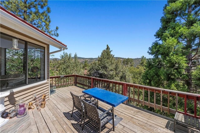 1104 Snowbird Dr, Frazier Park, CA 93225 - wooden terrace with outdoor dining space and a forest view