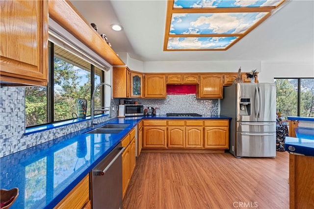 1104 Snowbird Dr, Frazier Park, CA 93225 - kitchen featuring stainless steel appliances, brown cabinetry, light wood-style floors, plenty of natural light, and recessed lighting