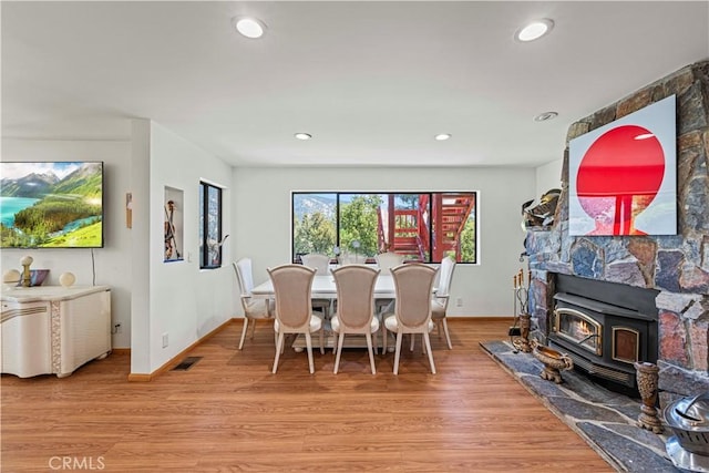 1104 Snowbird Dr, Frazier Park, CA 93225 - dining area with a wood stove, light wood-style flooring, and recessed lighting