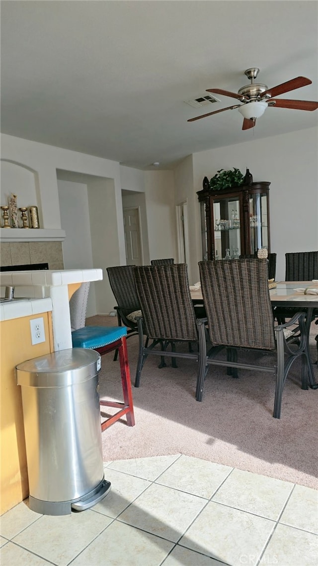 13749 Starshine Dr, Victorville, CA 92392 - dining room with light carpet, light tile patterned floors, and ceiling fan