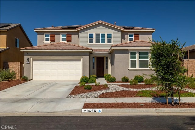 29526 Woodcreek Trl, Winchester, CA 92596 - traditional home featuring an attached garage, driveway, roof mounted solar panels, and stucco siding