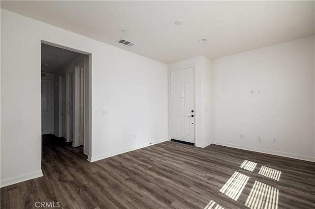 29526 Woodcreek Trl, Winchester, CA 92596 - unfurnished room with dark wood-style flooring and baseboards