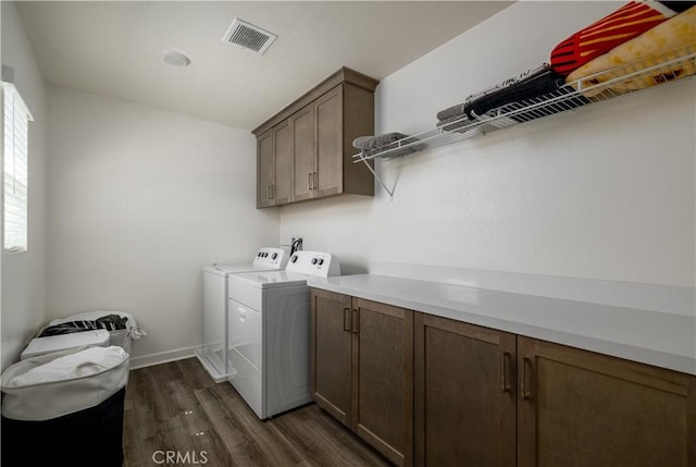 29526 Woodcreek Trl, Winchester, CA 92596 - laundry area with cabinet space, separate washer and dryer, and dark wood-style floors
