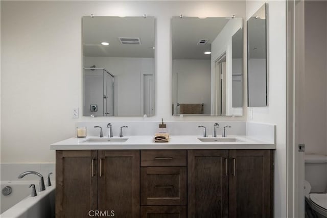 29526 Woodcreek Trl, Winchester, CA 92596 - bathroom with double vanity and a garden tub