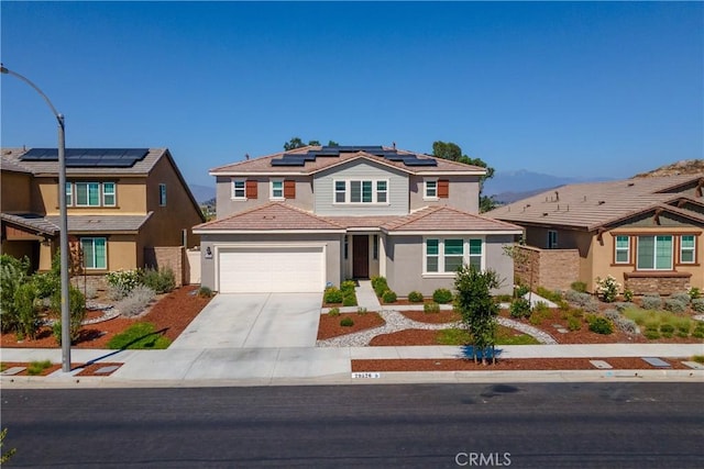 29526 Woodcreek Trl, Winchester, CA 92596 - traditional-style home featuring concrete driveway, roof mounted solar panels, stucco siding, a tile roof, and an attached garage
