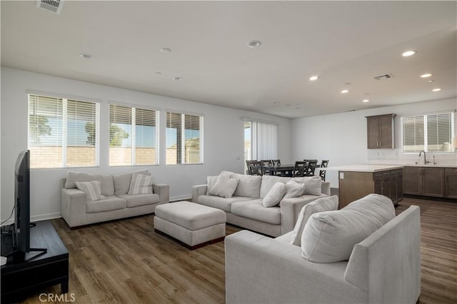 29526 Woodcreek Trl, Winchester, CA 92596 - living room with recessed lighting and dark wood-style flooring
