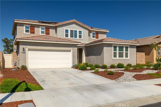 29526 Woodcreek Trl, Winchester, CA 92596 - traditional-style home featuring concrete driveway, roof mounted solar panels, stucco siding, and a tiled roof