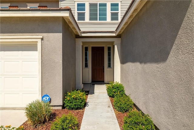 29526 Woodcreek Trl, Winchester, CA 92596 - doorway to property with a garage and stucco siding