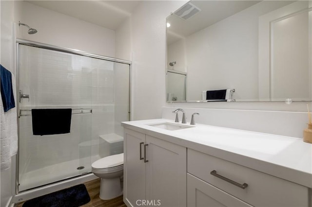 29526 Woodcreek Trl, Winchester, CA 92596 - full bath with vanity, a shower stall, and wood finished floors