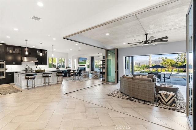 41783 Valencia Way, Temecula, CA 92592 - living room with ceiling fan and recessed lighting