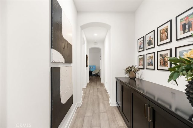 41783 Valencia Way, Temecula, CA 92592 - hall featuring arched walkways and light wood-style flooring