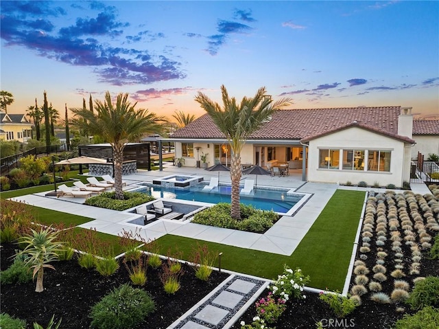 41783 Valencia Way, Temecula, CA 92592 - rear view of property featuring stucco siding, a pool with connected hot tub, a tiled roof, and a patio