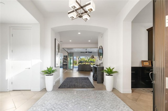 41783 Valencia Way, Temecula, CA 92592 - foyer with arched walkways, light tile patterned floors, a chandelier, recessed lighting, and a ceiling fan