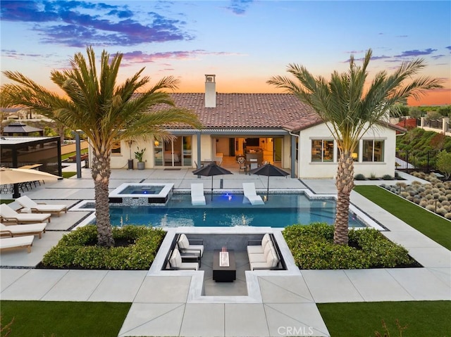 41783 Valencia Way, Temecula, CA 92592 - view of swimming pool with a patio area, a pool with connected hot tub, and an outdoor living space with a fire pit