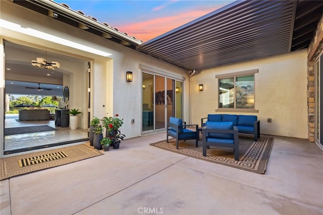 41783 Valencia Way, Temecula, CA 92592 - patio terrace at dusk featuring an outdoor living space, a patio, and a ceiling fan