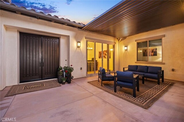 41783 Valencia Way, Temecula, CA 92592 - patio terrace at dusk with an outdoor living space and a patio