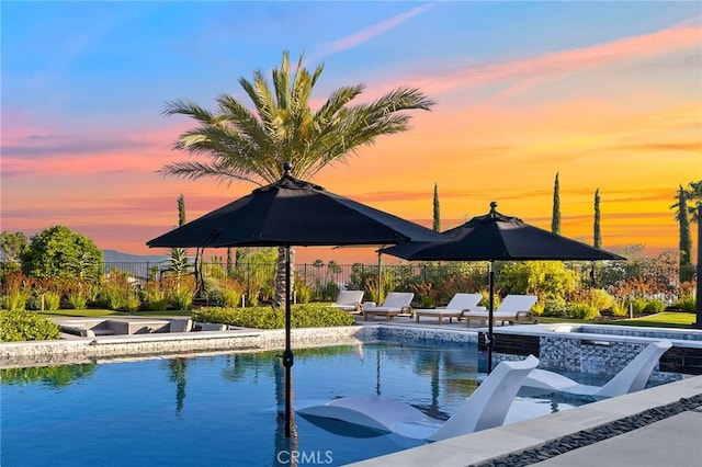 41783 Valencia Way, Temecula, CA 92592 - pool at dusk featuring a patio area