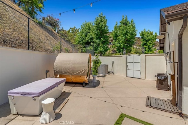 2056 Dublin Dr, Glendale, CA 91206 - fenced backyard with a hot tub, a patio area, and a gate