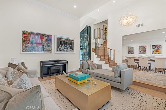 2056 Dublin Dr, Glendale, CA 91206 - living room with stairway, recessed lighting, a chandelier, ornamental molding, and light wood finished floors