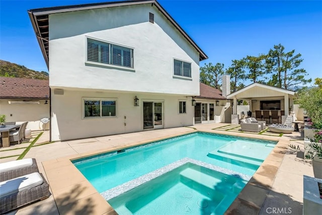 2056 Dublin Dr, Glendale, CA 91206 - rear view of property with stucco siding, a patio, outdoor lounge area, and a pool with connected hot tub