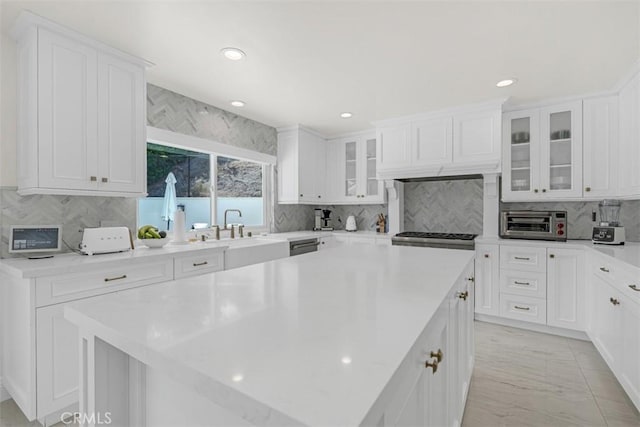 2056 Dublin Dr, Glendale, CA 91206 - kitchen featuring a kitchen island, tasteful backsplash, white cabinetry, light countertops, and recessed lighting