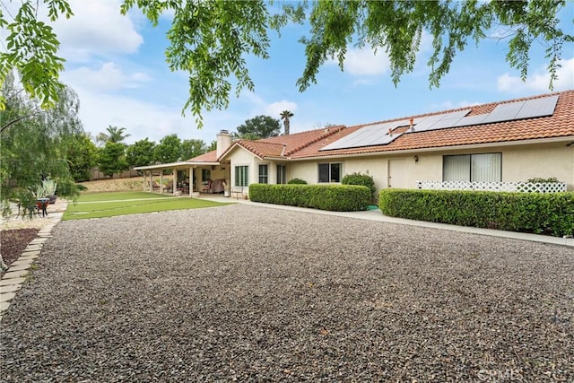 16151 Sunset Way, Valley Center, CA 92082 - ranch-style house featuring solar panels, a chimney, a tile roof, and stucco siding