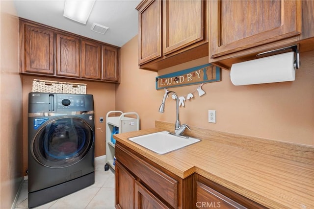 16151 Sunset Way, Valley Center, CA 92082 - laundry area with washer / dryer, cabinet space, and light tile patterned floors
