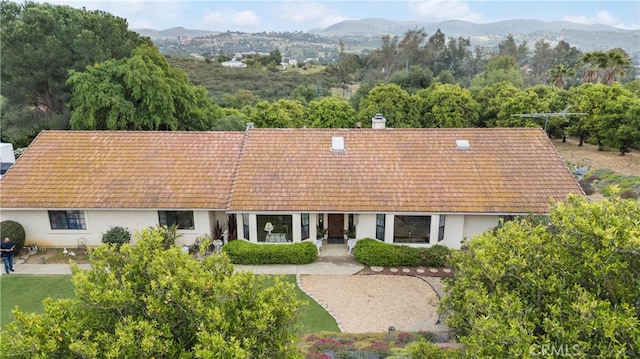 16151 Sunset Way, Valley Center, CA 92082 - view of front facade featuring stucco siding, a mountain view, a patio, and a chimney