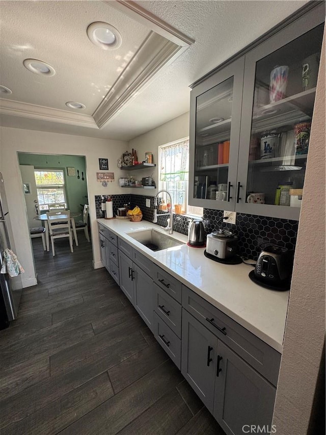 825 E Eagle St, Long Beach, CA 90806 - kitchen with open shelves, light countertops, healthy amount of natural light, decorative backsplash, and crown molding