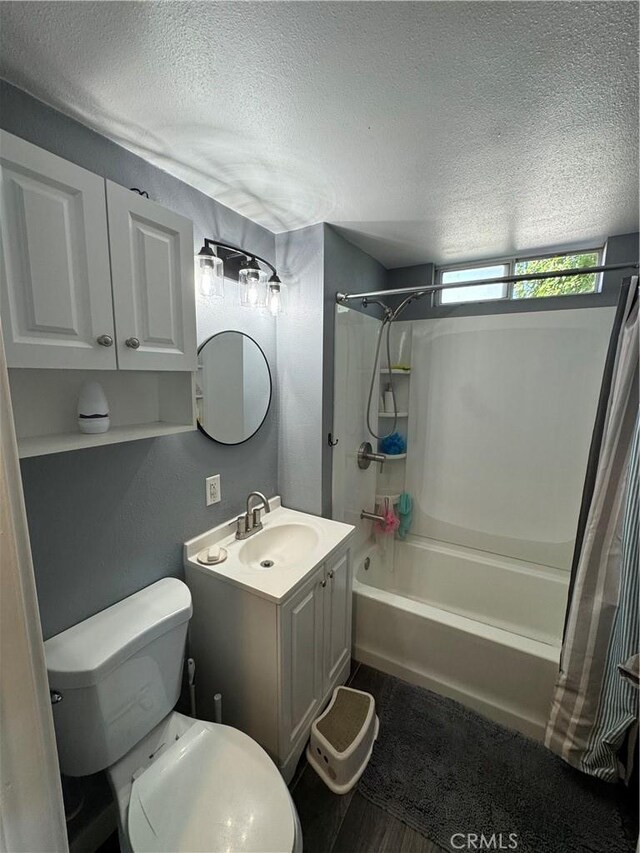 825 E Eagle St, Long Beach, CA 90806 - bathroom with a textured ceiling, shower / bath combo with shower curtain, vanity, and wood finished floors