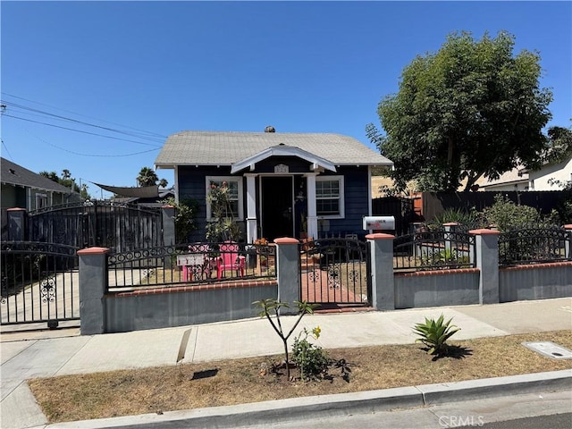 825 E Eagle St, Long Beach, CA 90806 - bungalow featuring a fenced front yard and a gate