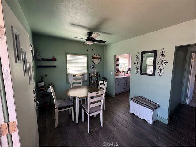 825 E Eagle St, Long Beach, CA 90806 - dining room with ceiling fan, dark wood-style floors, and cooling unit